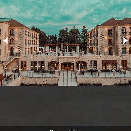 Hotel Buona Vitta Gramado by Gramado Parks Esterno foto The photo shows a spacious and elegant building design, likely a hotel or resort. The structure features multiple stories and large windows, with outdoor seating areas visible on a terrace or patio. The exterior has a combination of stone and modern 